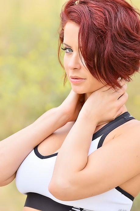 Redheaded mature chick shows her perfect ass in tight yoga pants