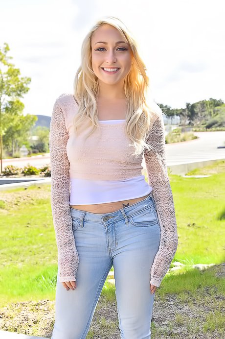 Playful blonde shows her ass and pierced nipples while outdoors